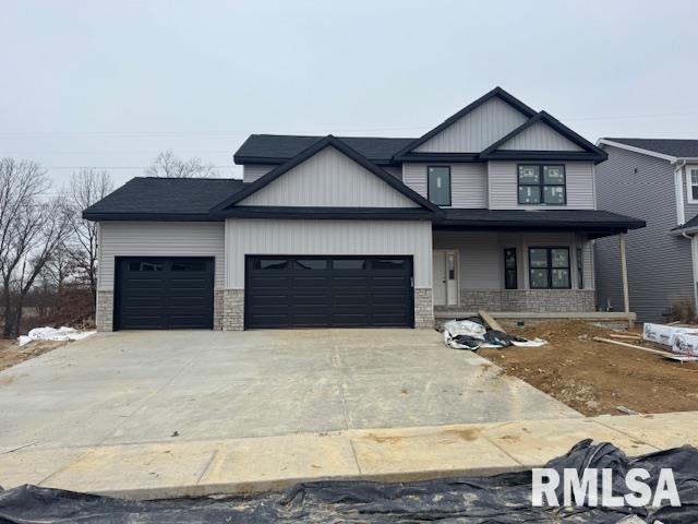 view of front of property with a garage and a porch