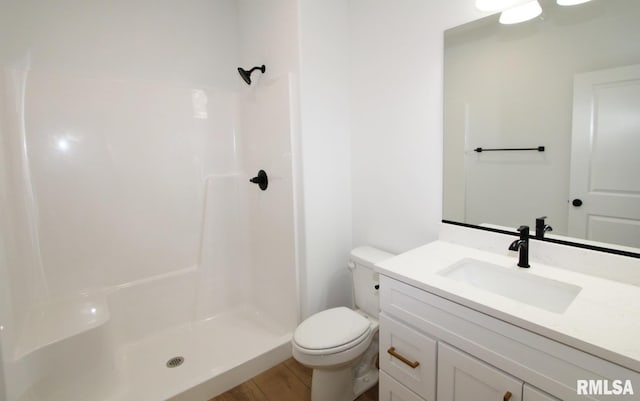 7023 N Water Oak Dr, Edwards, IL 61528 - bathroom with vanity, toilet, a shower, and wood finished floors