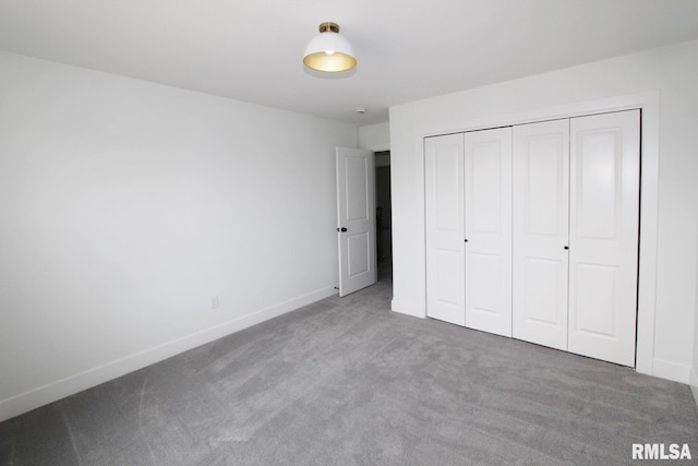 7023 N Water Oak Dr, Edwards, IL 61528 - unfurnished bedroom featuring carpet floors, a closet, and baseboards
