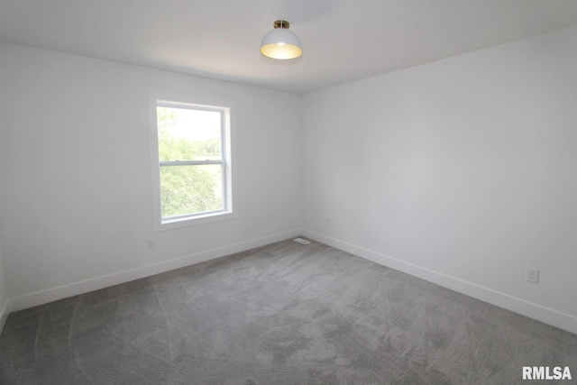 7023 N Water Oak Dr, Edwards, IL 61528 - spare room with baseboards and carpet flooring