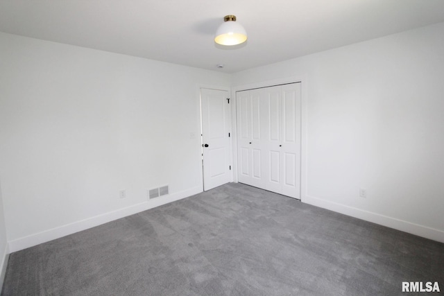 7023 N Water Oak Dr, Edwards, IL 61528 - unfurnished bedroom featuring carpet floors, baseboards, and a closet