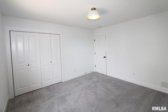 7023 N Water Oak Dr, Edwards, IL 61528 - unfurnished bedroom with carpet flooring, baseboards, and a closet