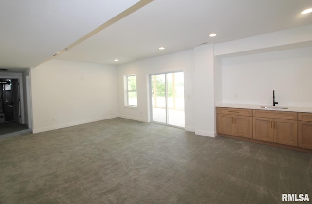 7023 N Water Oak Dr, Edwards, IL 61528 - unfurnished living room with a sink, dark colored carpet, recessed lighting, and baseboards