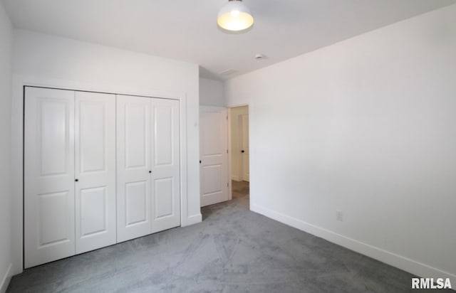 7023 N Water Oak Dr, Edwards, IL 61528 - unfurnished bedroom with carpet floors, baseboards, and a closet
