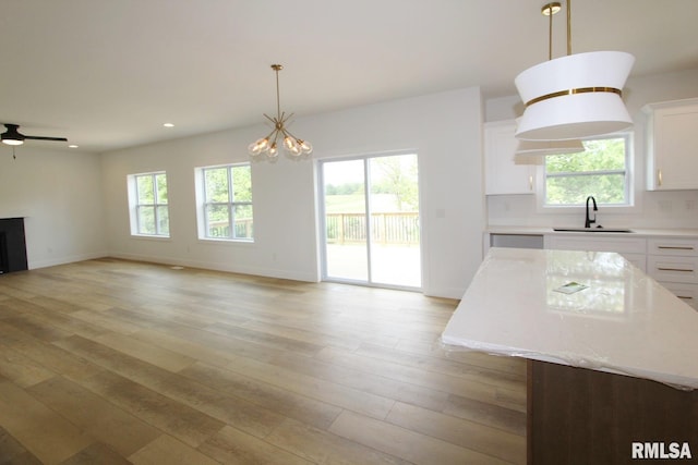 7023 N Water Oak Dr, Edwards, IL 61528 - kitchen featuring a sink, light countertops, plenty of natural light, open floor plan, and recessed lighting