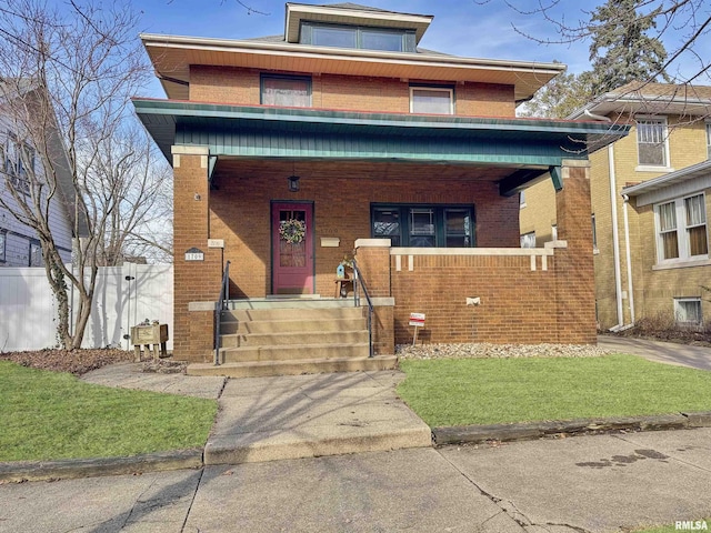 view of front of house featuring a porch and a front yard