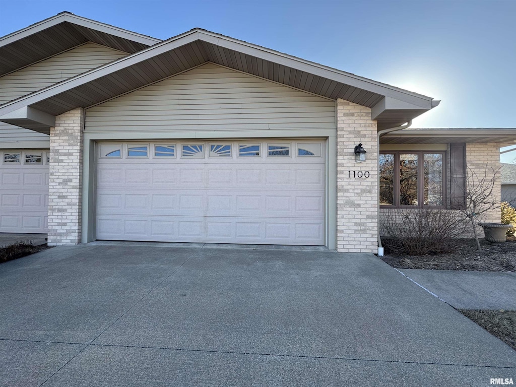 exterior space with concrete driveway