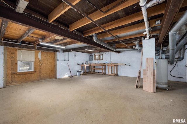 basement with water heater and electric panel