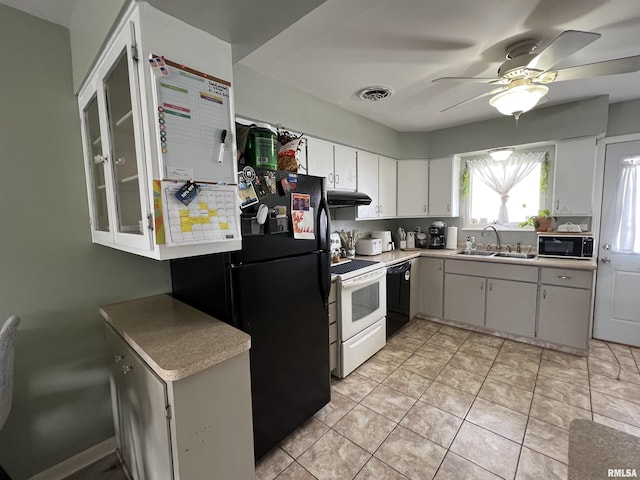 kitchen with light tile patterned flooring, white cabinetry, sink, ceiling fan, and black appliances