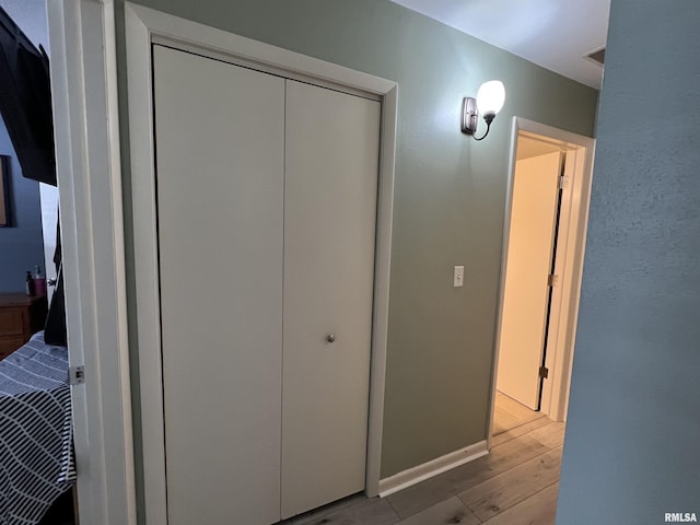 interior space featuring light hardwood / wood-style floors and a closet