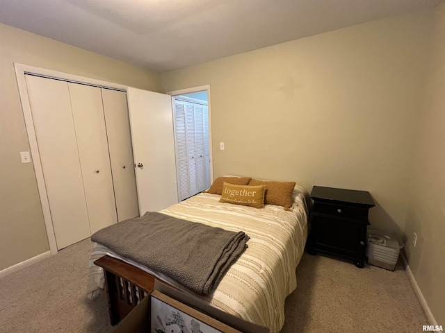 bedroom featuring light carpet and a closet