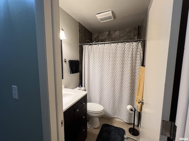 bathroom featuring tile patterned floors, toilet, a shower with shower curtain, and vanity