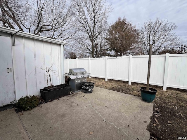 view of patio featuring a grill