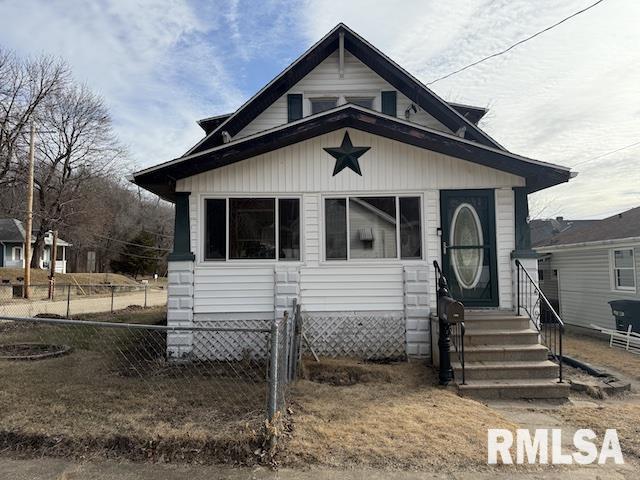 bungalow with fence and entry steps