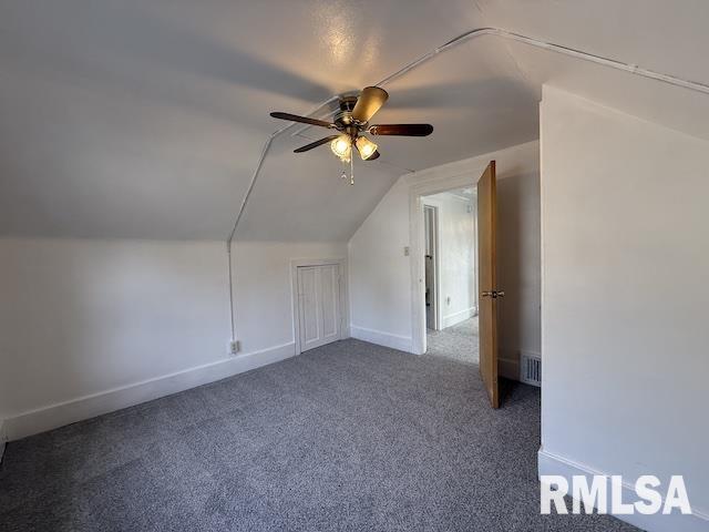 bonus room featuring ceiling fan, lofted ceiling, and carpet flooring