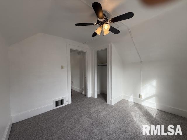 additional living space with lofted ceiling, ceiling fan, and carpet