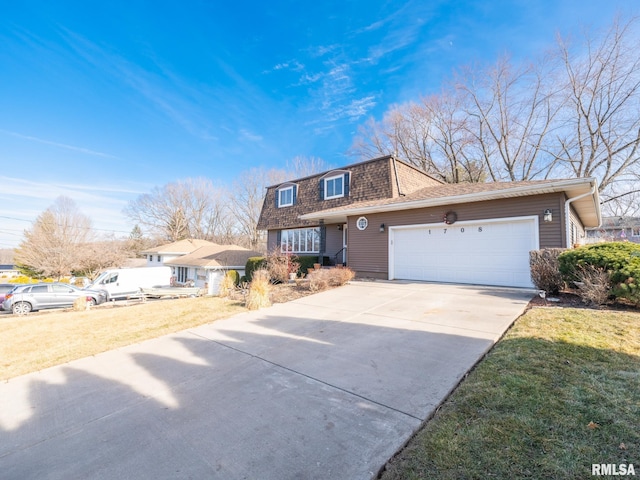 view of front of house featuring a garage and a front yard