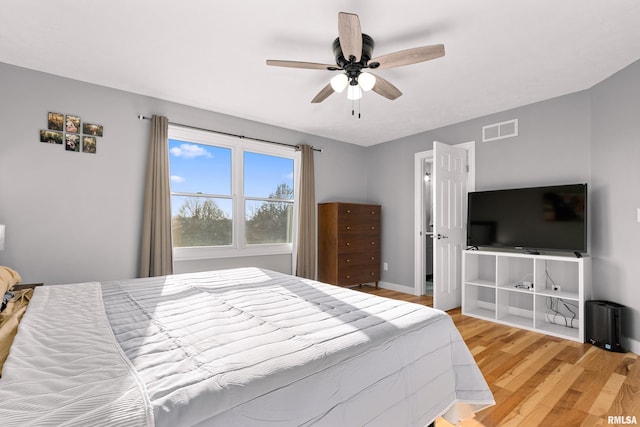 bedroom featuring hardwood / wood-style flooring and ceiling fan