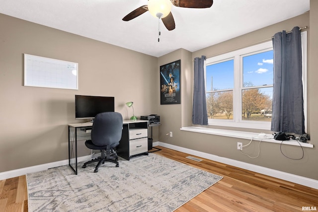 office space with hardwood / wood-style flooring and ceiling fan