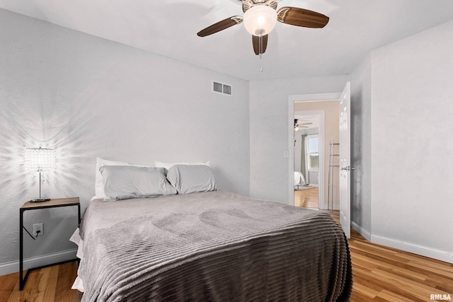 bedroom featuring ceiling fan and light wood-type flooring