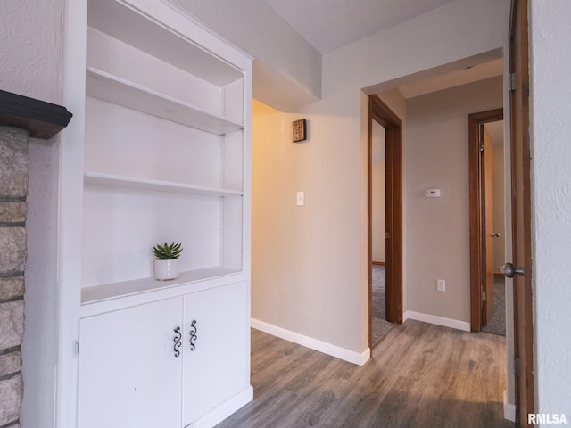 corridor featuring hardwood / wood-style floors