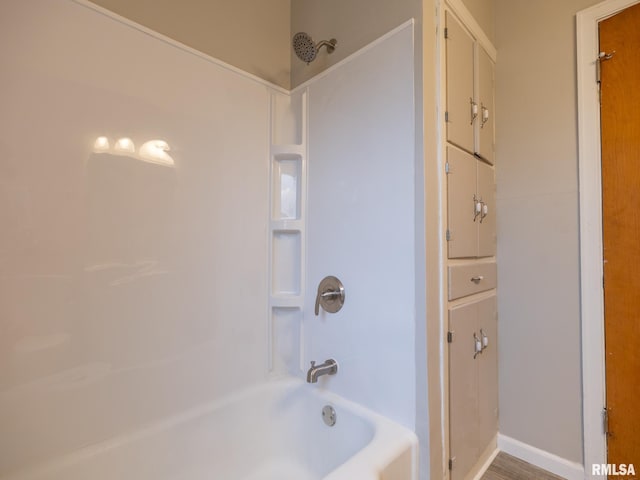 bathroom with bathing tub / shower combination