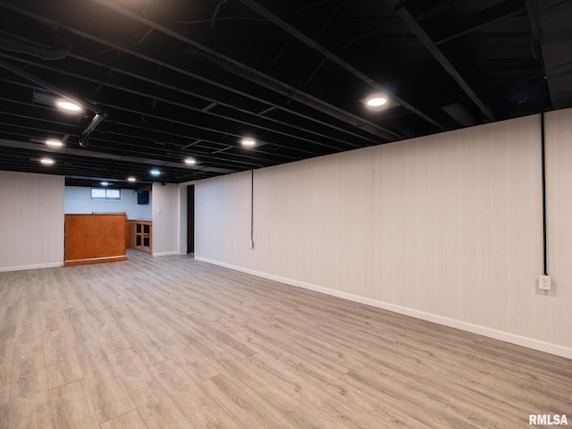 basement featuring hardwood / wood-style floors