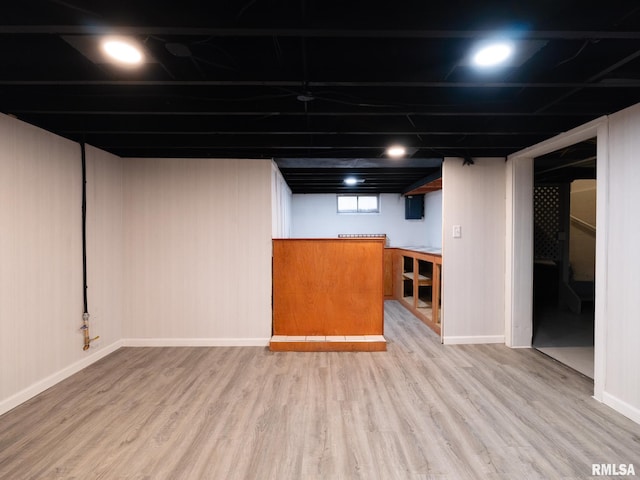 basement featuring hardwood / wood-style flooring