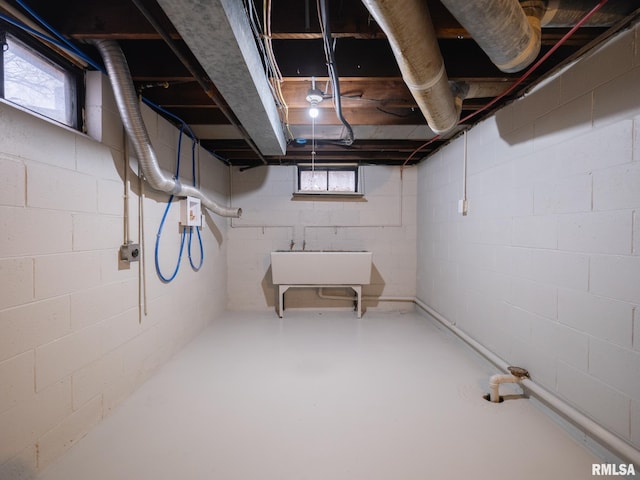 basement featuring plenty of natural light and sink