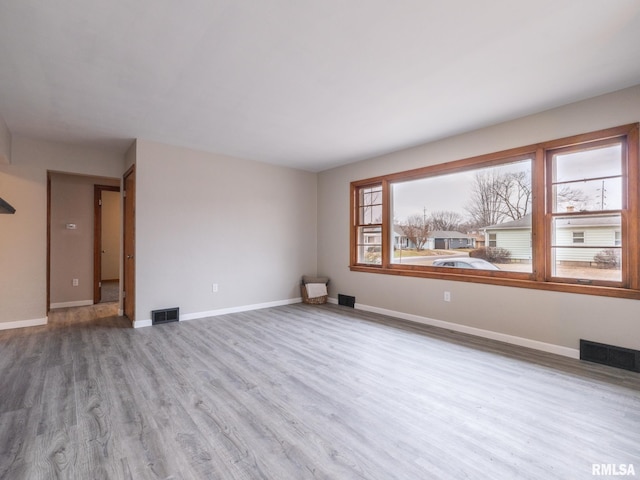 unfurnished room featuring hardwood / wood-style floors