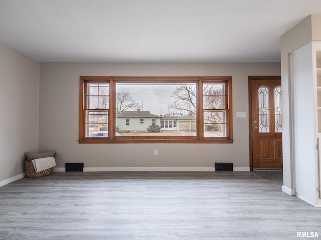 entryway with light hardwood / wood-style flooring