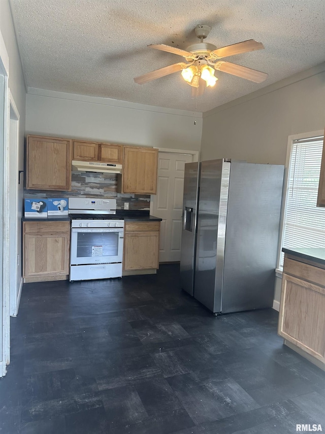 1822 N Sheridan Rd, Peoria, IL 61604 - kitchen with white gas range oven, stainless steel fridge with ice dispenser, under cabinet range hood, a ceiling fan, and a textured ceiling