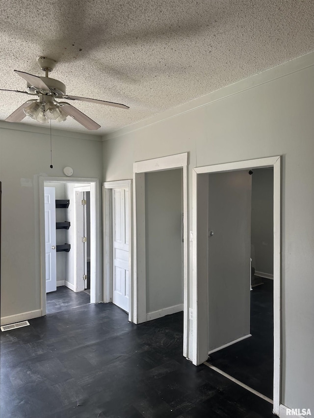 1822 N Sheridan Rd, Peoria, IL 61604 - unfurnished room with a textured ceiling, a ceiling fan, and baseboards