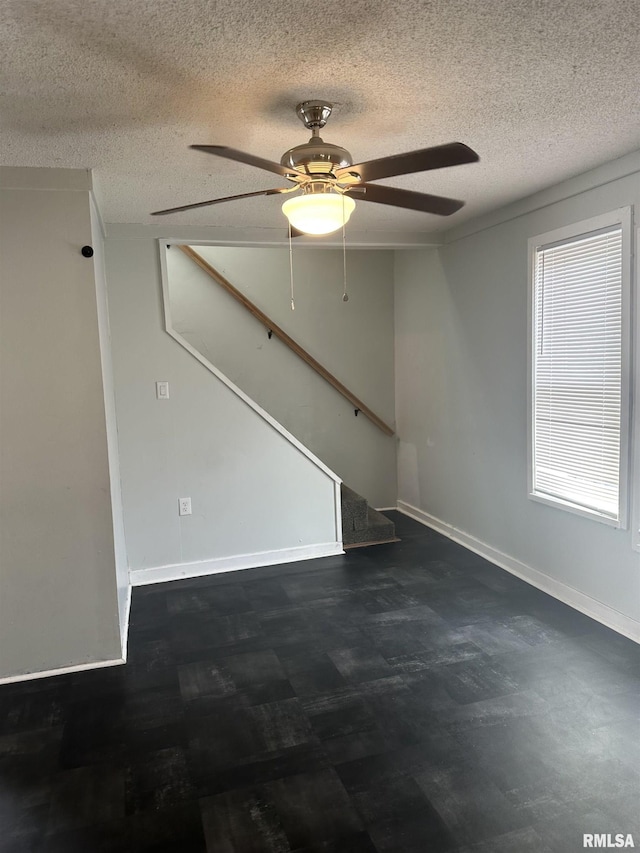 1822 N Sheridan Rd, Peoria, IL 61604 - empty room with a textured ceiling, a ceiling fan, stairway, and baseboards