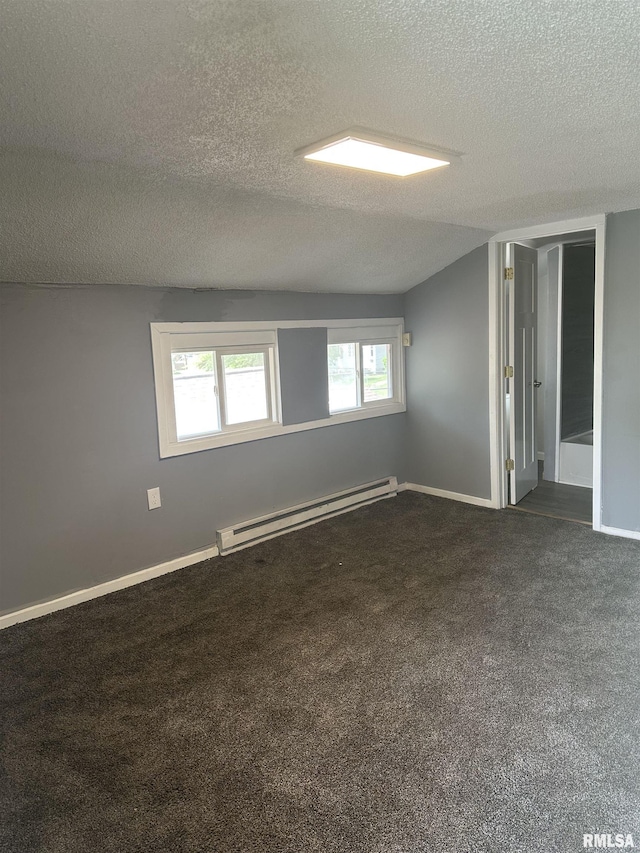 1822 N Sheridan Rd, Peoria, IL 61604 - empty room featuring baseboard heating, a textured ceiling, dark carpet, and baseboards