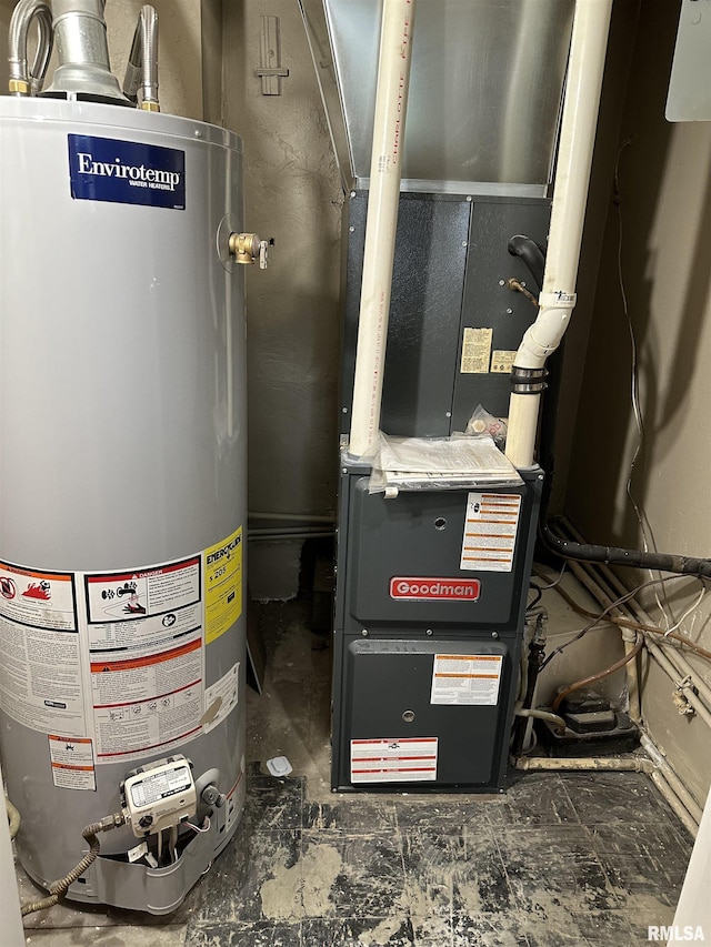 utility room featuring heating unit and water heater