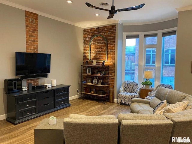 living room featuring crown molding, light hardwood / wood-style flooring, and ceiling fan