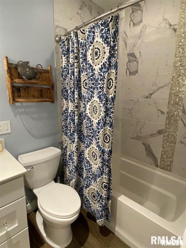 full bathroom with vanity, hardwood / wood-style floors, toilet, and shower / tub combo with curtain