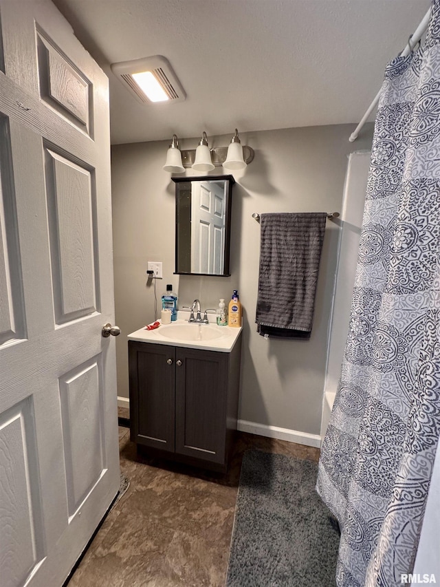 bathroom with vanity and shower / tub combo with curtain