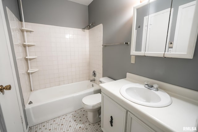 full bathroom with tile patterned floors, toilet, tiled shower / bath combo, and vanity