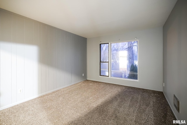 unfurnished room featuring carpet flooring