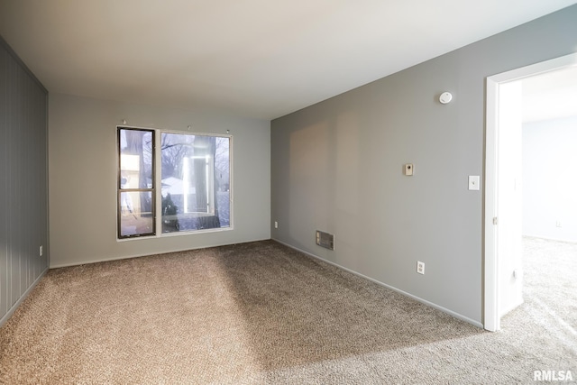 spare room with light carpet