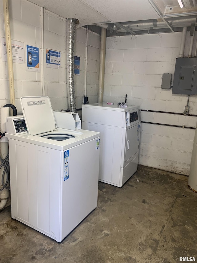 laundry area with washer and clothes dryer and electric panel