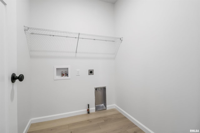 laundry room with hookup for a washing machine, wood-type flooring, and hookup for an electric dryer