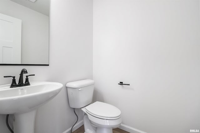 bathroom with toilet and sink