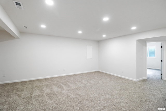 unfurnished room with light colored carpet