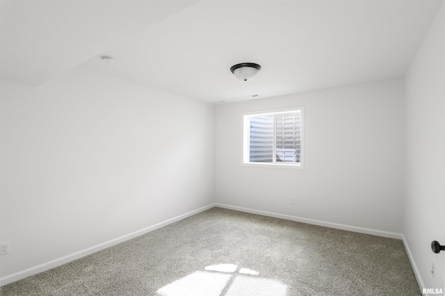 unfurnished room with carpet flooring