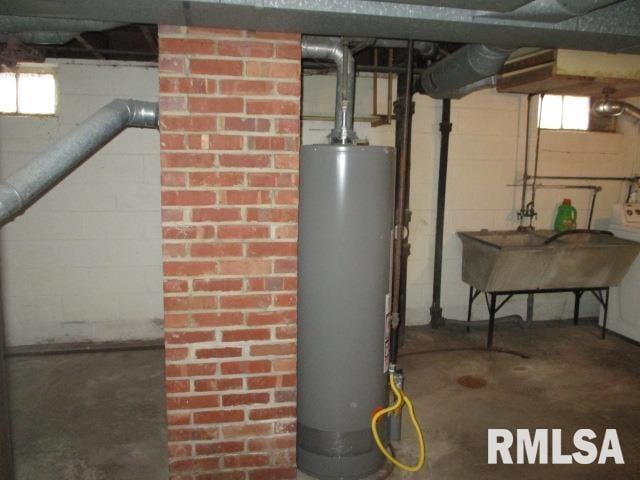 utility room featuring gas water heater