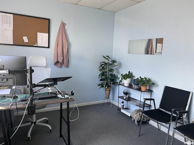 office area with a paneled ceiling