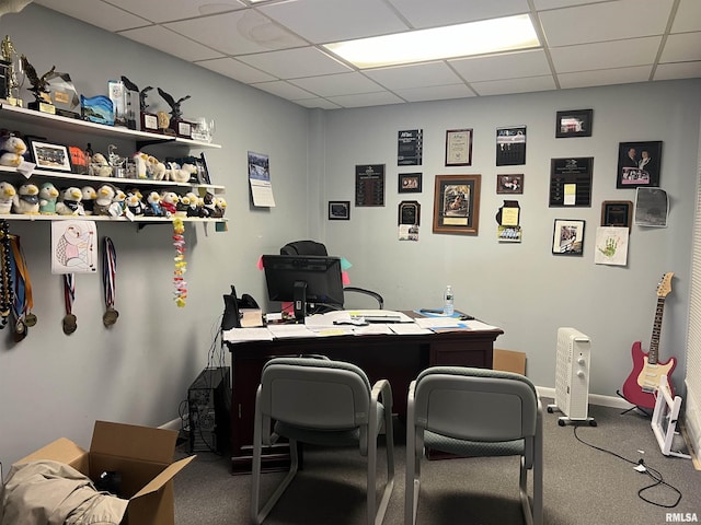 home office featuring carpet flooring and a drop ceiling